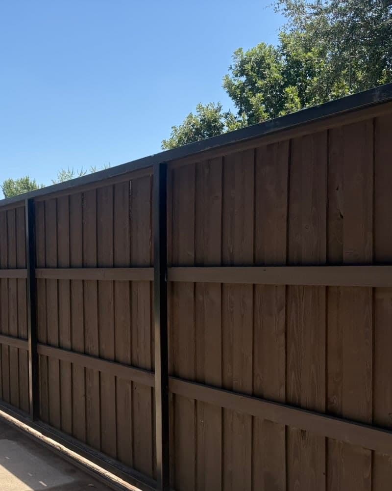The same wood privacy fence after staining